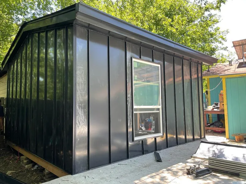 Black standing seam metal wall panels for Metal Roof Installation in Niles